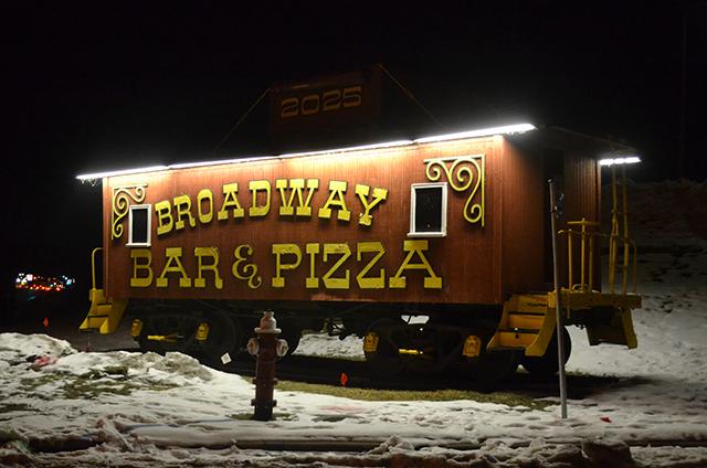 You can recognize Broadway Pizza by the old rail car they use as a landmark on t