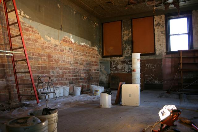 The back room, with focal point brick walls, will become an entertainment venue 
