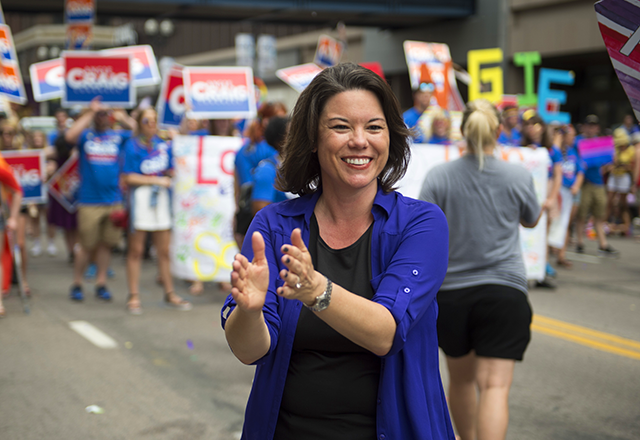 Angie Craig greeting attendees of the 2018 Twin Cities Pride Parade.