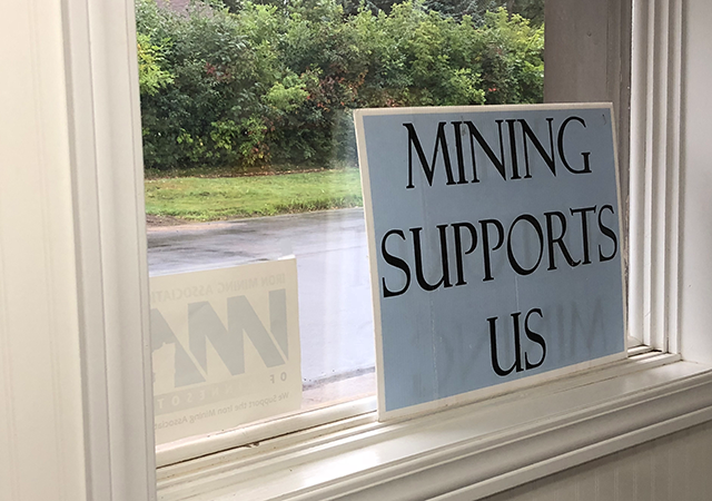 A sign promoting mining in a window at Lind Industrial Supply.