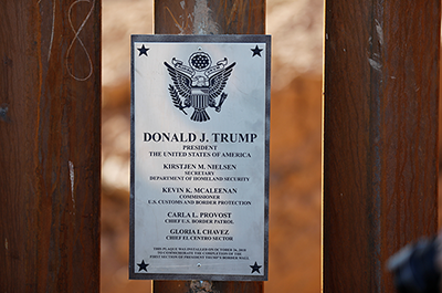 A plaque mounted to President Donald Trump's border wall