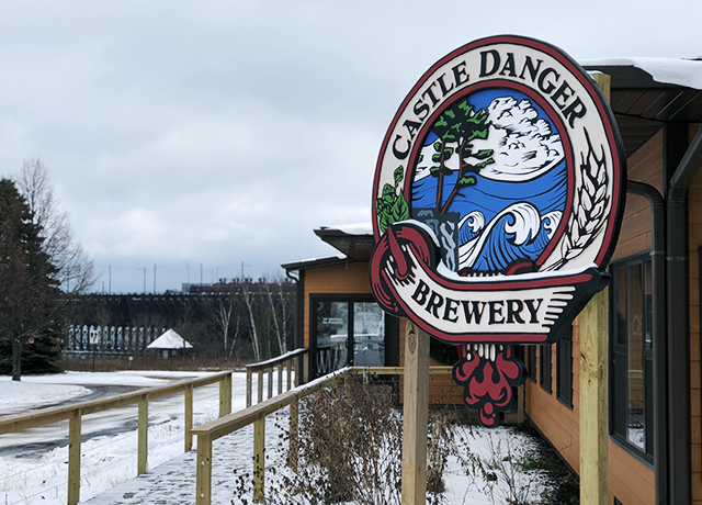 Castle Danger Brewery in Two Harbors, with the massive ore docks of Agate Bay in the background.