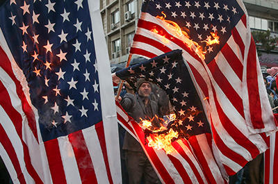 Iranians burn U.S. flags during a ceremony