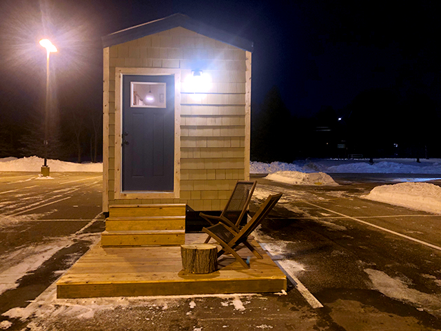 A tiny house prototype sits in the parking lot of Maplewood’s Woodland Hills Church.