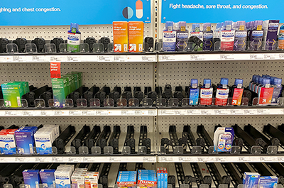 Empty cold and flu medicine shelves are shown at a Target store