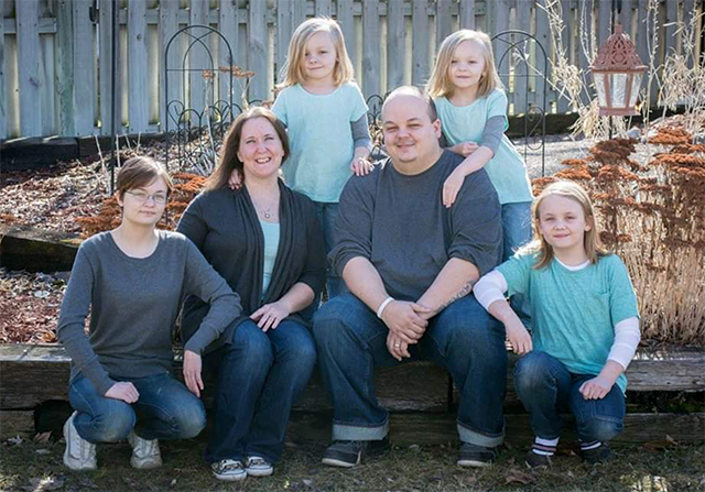 The Rogers family, back left to right: twins Hailee and Haycen. Front row: Dani, mother Missy, father Mike, and Madison.