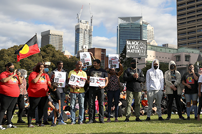 People gather during a demonstration in solidarity with the Black Lives Matter