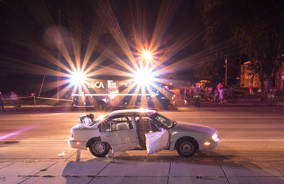 The car of Philando Castile is seen surrounded by police vehicles in an evidence photo taken after he was fatally shot by St. Anthony Police Department officer Jeronimo Yanez during a traffic stop in July 2016.