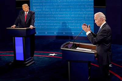 Former Vice President Joe Biden answers a question as President Donald Trump listens