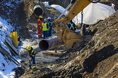 An Enbridge oil pipeline shown being worked on in East Don Parkland in Toronto, on March 6, 2014.