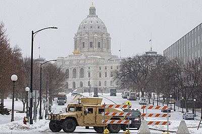 A National Guard armored vehicle blocks off a street on the south side of the Minnesota State Capitol on January 19.