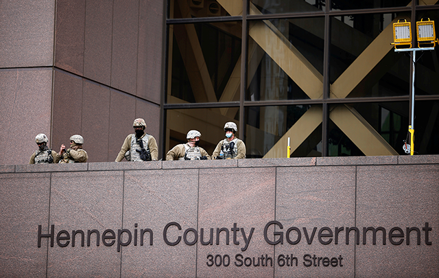 Members of the National Guard are seen at the Hennepin County Government Center on Tuesday.