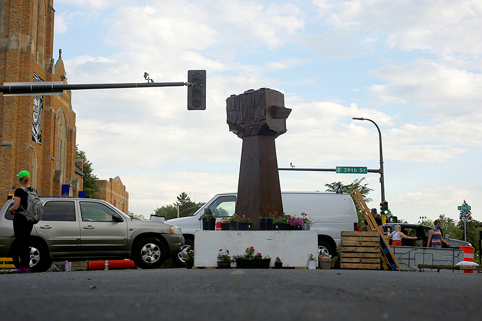 A new fist sculpture stands in George Floyd Square.