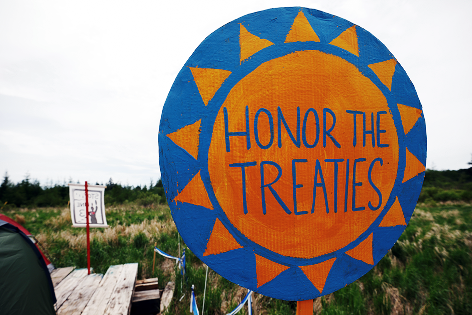 A protest sign on display at a camp established by indigenous leaders and water protectors at the Mississippi headwaters, in Solway, Minnesota.