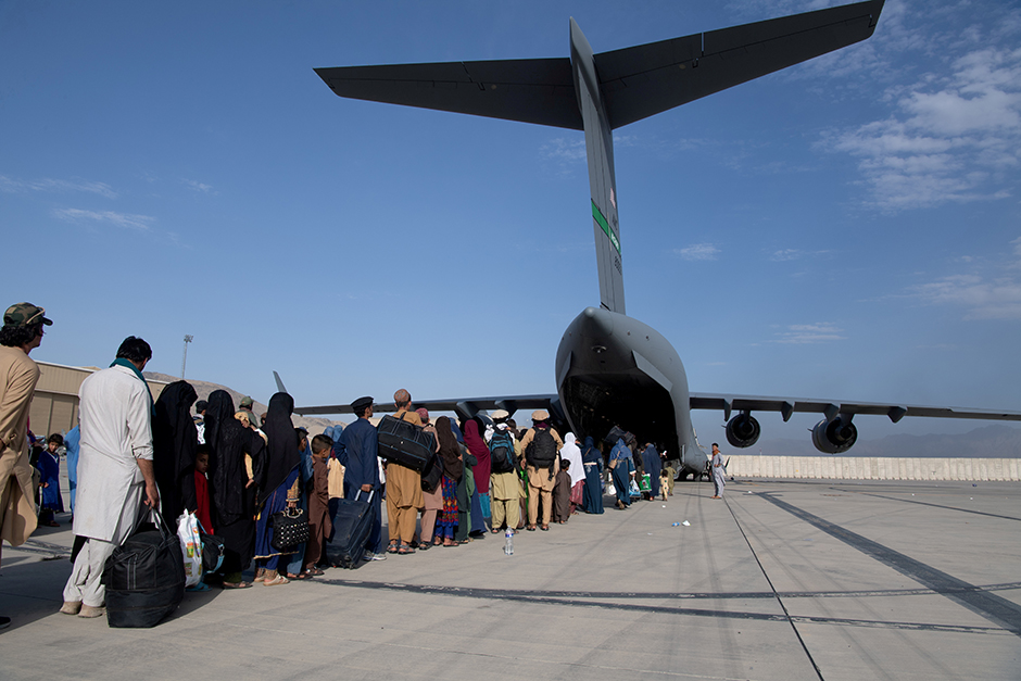 U.S. Air Force loadmasters and pilots assigned to the 816th Expeditionary Airlift Squadron, loading passengers aboard a U.S. Air Force C-17 Globemaster III during the Afghanistan evacuation at Hamid Karzai International Airport.
