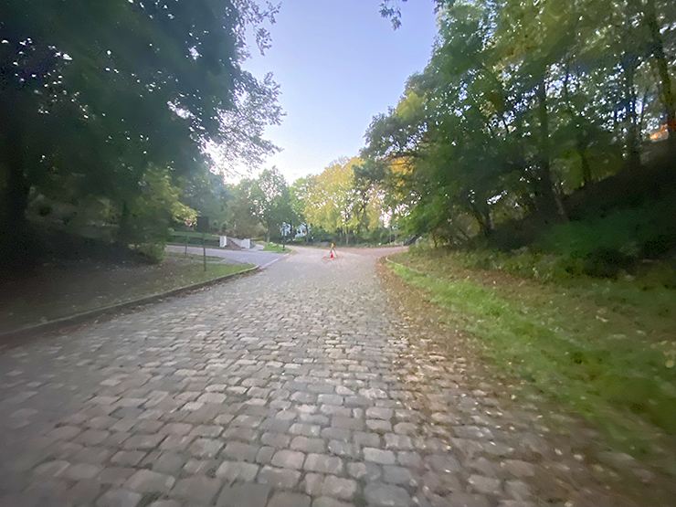 image showing cobblestone-lined roadway
