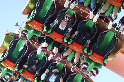 People riding a roller coaster