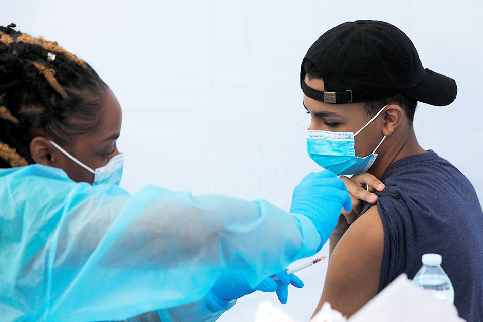 A teenage student receiving a dose of the Pfizer-BioNTech vaccine.