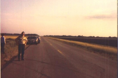 image of sheriffs deputy standing on road