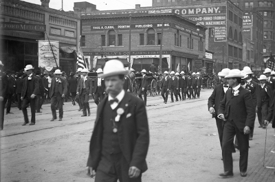 historic photo of workers walking in parade