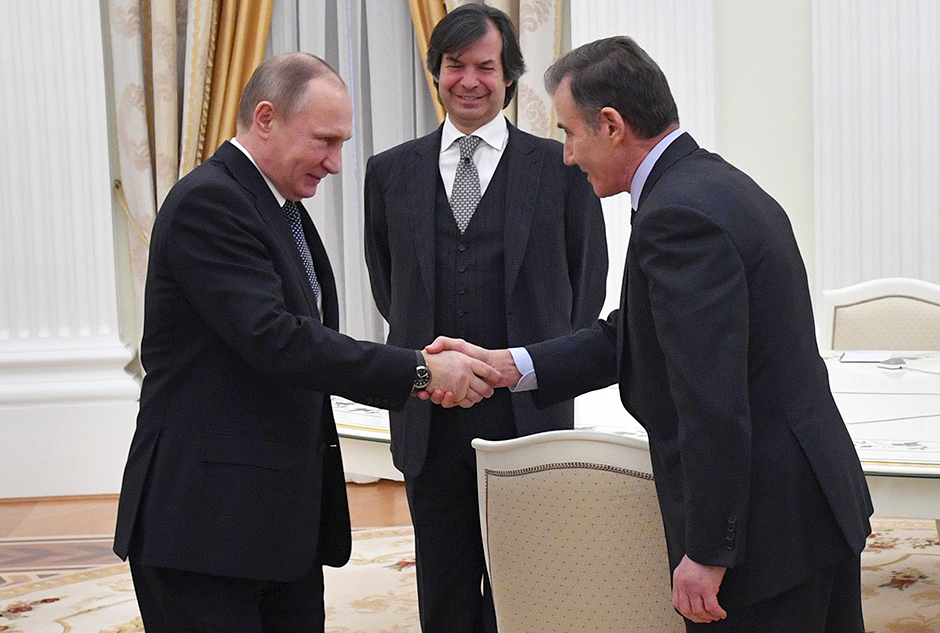 Russian President Vladimir Putin greeting Glencore CEO Ivan Glasenberg, as Bank Intesa CEO Carlo Messina looks on, in a photo from 2017.