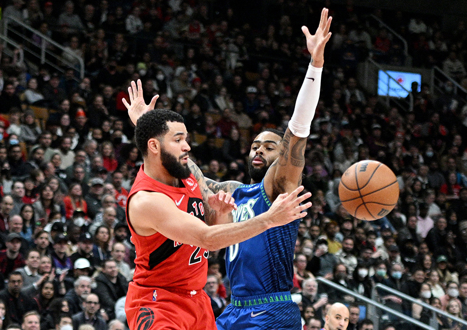 Toronto Raptors guard Fred VanVleet passing the ball past Timberwolves guard D'Angelo Russell in the first half of Wednesday night's game.