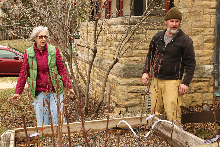 Lisa Burke and Chris Stevens tending to the Canopy Connectors gravel bed at Unity Church in St. Paul.