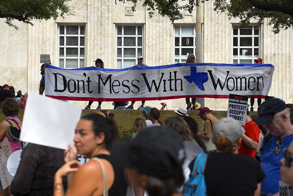 Abortion rights protesters participating in a Houston, Texas, demonstration following the leaked Supreme Court opinion suggesting the possibility of overturning Roe v. Wade.