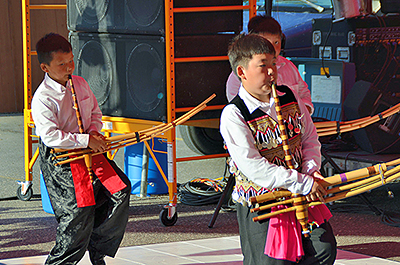 Young boys playing traditional Hmong instruments
