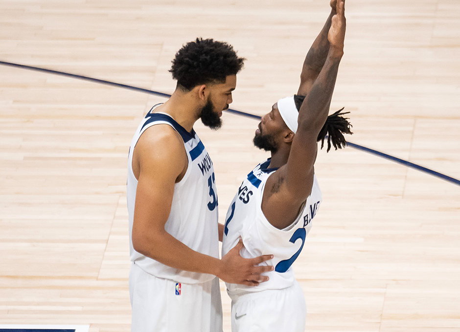 Karl-Anthony Towns and Patrick Beverley talking during a timeout against the Memphis Grizzlies in the fourth quarter during game four of the first round of the 2022 NBA playoffs at Target Center.