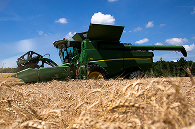 John Deere combine harvester to harvest wheat