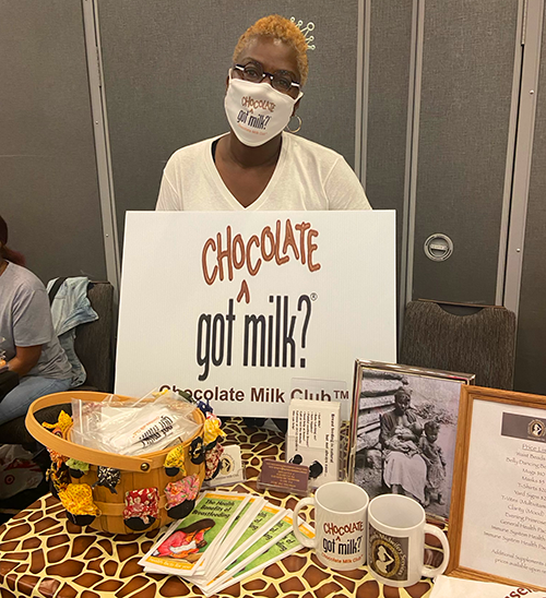 LaVonne Moore promoting the Chocolate Milk Club at a community event.