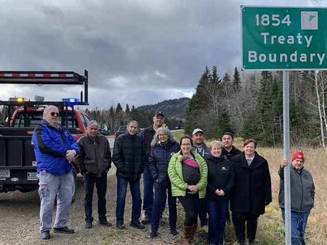 Officials mark placement of tribal boundary markers.