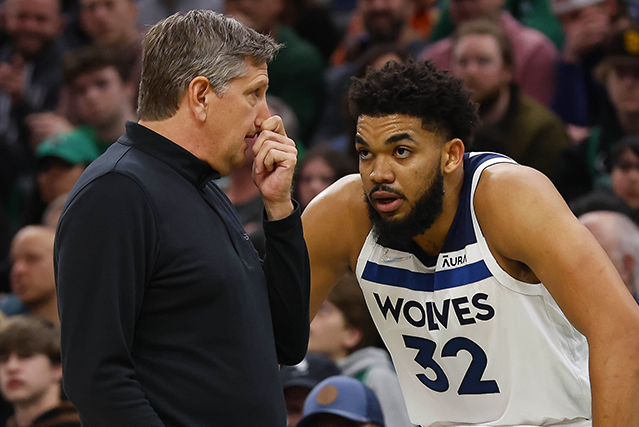 Minnesota Timberwolves head coach Chris Finch talking with center Karl-Anthony Towns