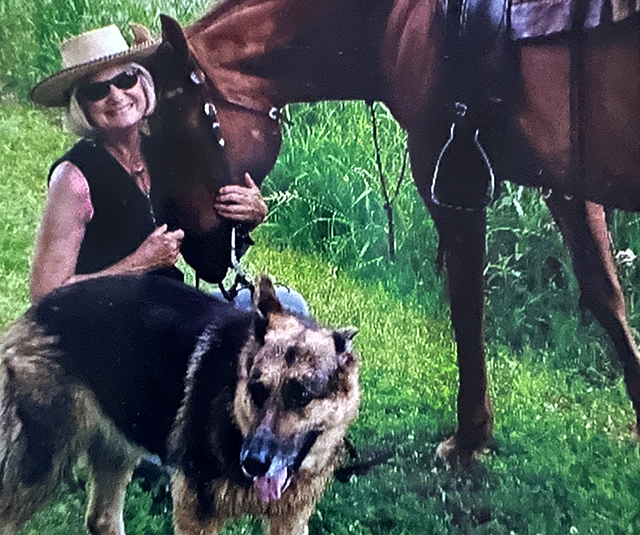 Nancy Skoog-Edholm shown with her horse and dog.