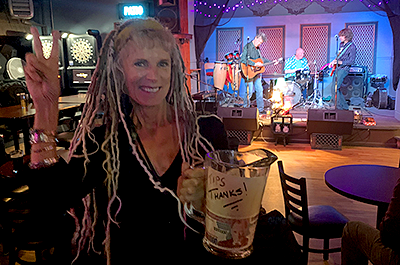 Lynn Schultz passing the tip bucket at the Schooner Tavern in Minneapolis last month.