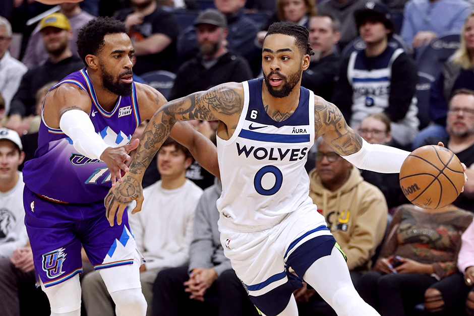 Timberwolves guard D'Angelo Russell working around Utah Jazz guard Mike Conley in the first quarter at Target Center on Monday night.