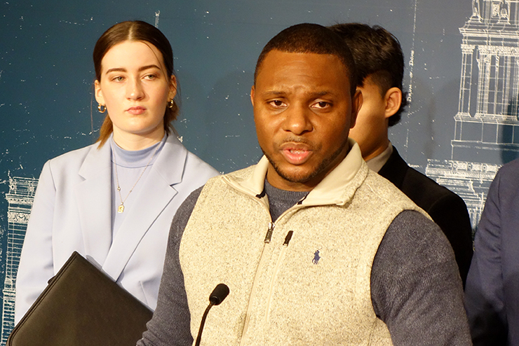 Elizer Darris, co-executive director of Minnesota Freedom Fund, spoke Monday on behalf of the restore-the-vote bill. Katie Taffe, the governor of the YMCA Youth in Government, is at left.