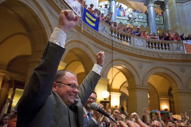 Richard Carlbom celebrating in the Capitol Rotunda following the Senate vote in 2013.