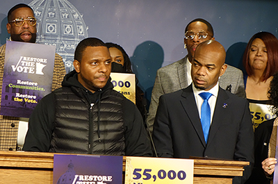 Elizer Darris, center, was one of the plaintiffs in the lawsuit. State Rep. Cedrick Frazier, right, is the prime sponsor of the bill to restore voting rights at release from incarceration.