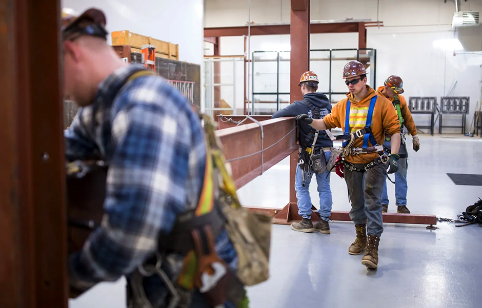 Garret Morgan, right, training in 2018 to become an ironworker. Demand for ironworkers is growing 4 percent a year; even as a 20-year-old apprentice, Morgan was earning $28.36 an hour, plus benefits.