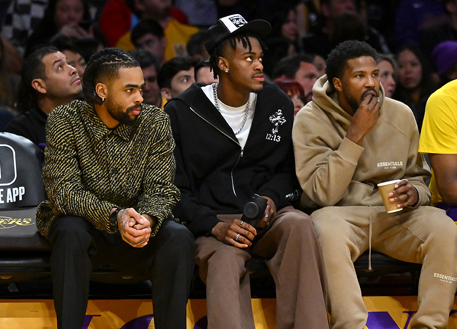 From left: Los Angeles Lakers guard D'Angelo Russell, forward Jarred Vanderbilt and guard Malik Beasley look on from the bench during Thursday night’s game against the Milwaukee Bucks at Crypto.com Arena.