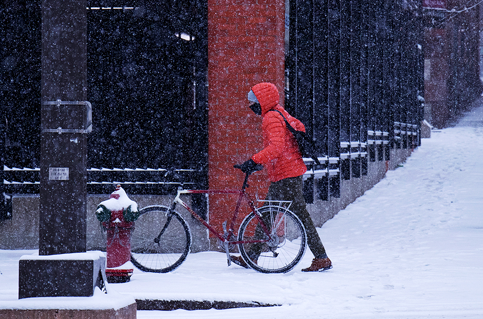 Walking a bike in the snow
