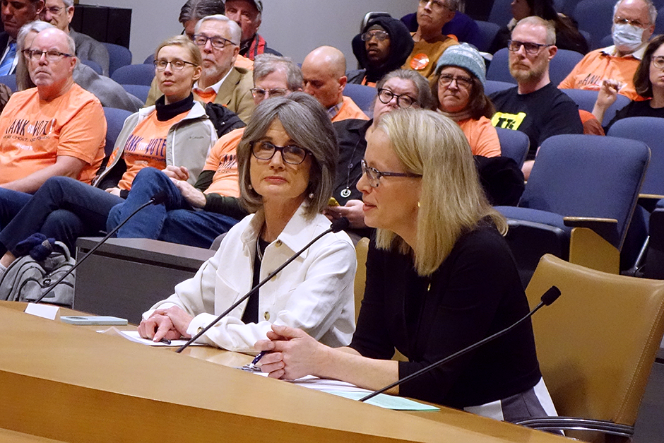 Jeanne Massey, executive director of Fair Vote Minnesota, and state Sen. Kelly Morrison shown speaking in front of the Senate Elections Committee.