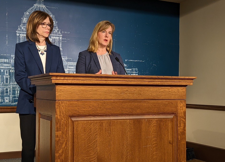 two women at a podium