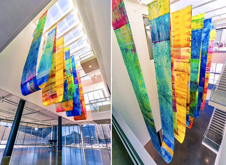 In a new commission, “Will to Meaning,” (2023), Anne Labovitz hangs giant scrolls in the atrium of the building, cascading down over numerous stories.