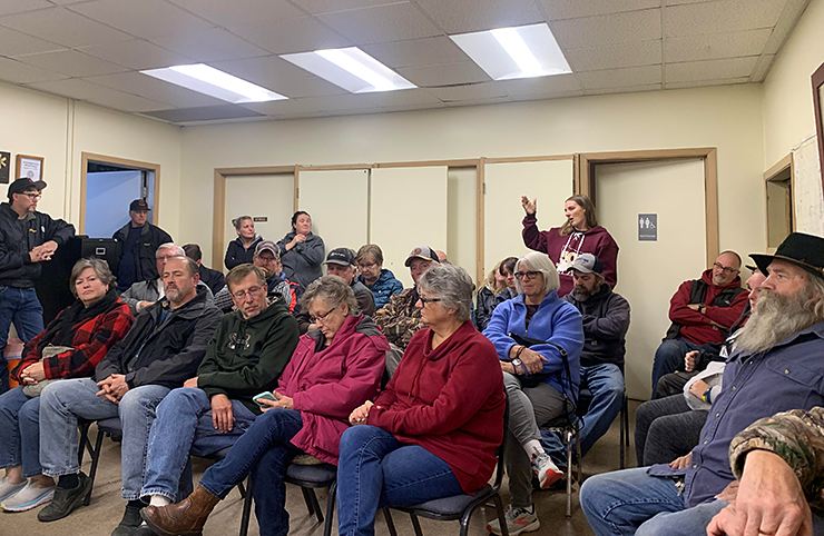 Jessica Paulson speaks in the back row during a meeting in Blackhoof Township on Wednesday, October 19. Residents have protested the arrival of a “green” cemetery into the township on Pioneer Road.