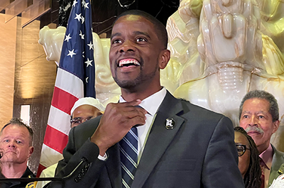 St. Paul Mayor Melvin Carter straightening his tie as he begins a press conference in the lobby of City Hall on May 31.