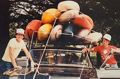 Donna's husband, Bill, took this photo of their two employees back when the trucker-style hats were first popular. That load of kayaks was headed to Minneapolis (250 miles away) when most of the trip was two-lane roads. They all made it there and back again.
