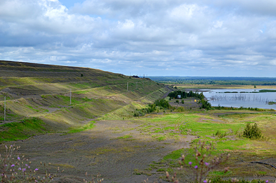 Plans for PolyMet included building dams to increase the storage capacity of tailings basins. One would be built in the distance to raise the basin on the right to the level of the area on the left.